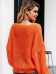 Pomarańczowy sweter oversize gruby warkocz z przodu 2