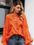 Pomarańczowy sweter oversize gruby warkocz z przodu 3