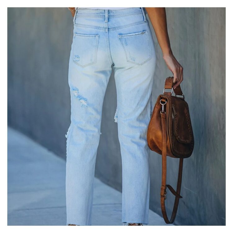 Jeansy spodnie z dużymi dziurami damskie w kolorze jasny denim 2