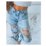 Spodnie jeansy z dziurami damskie w kolorze jasny denim typu rurki 3